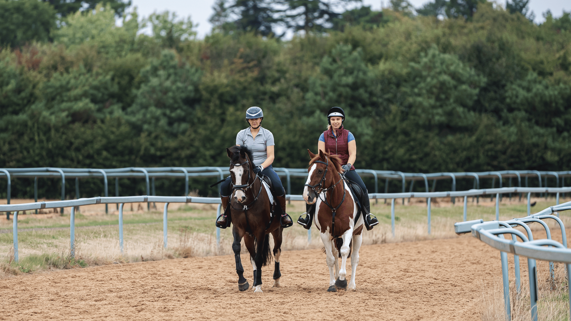 Kiera and Sophie walking on the gallops